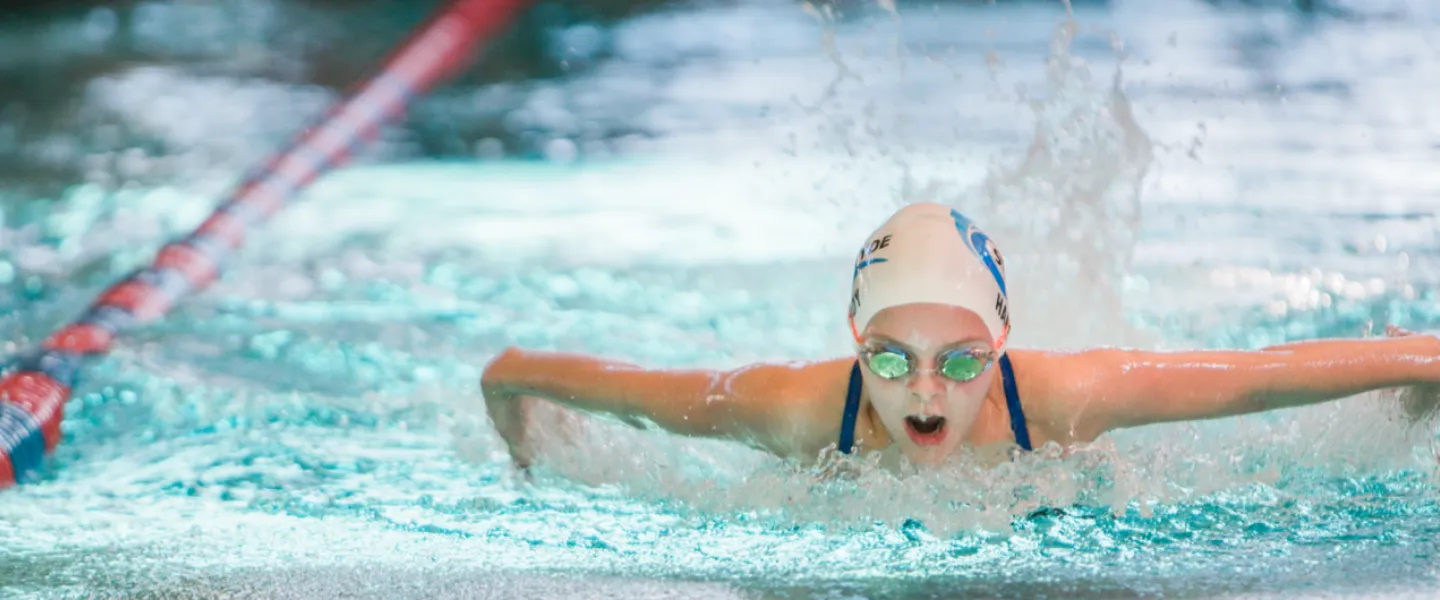 Person swimming butterly