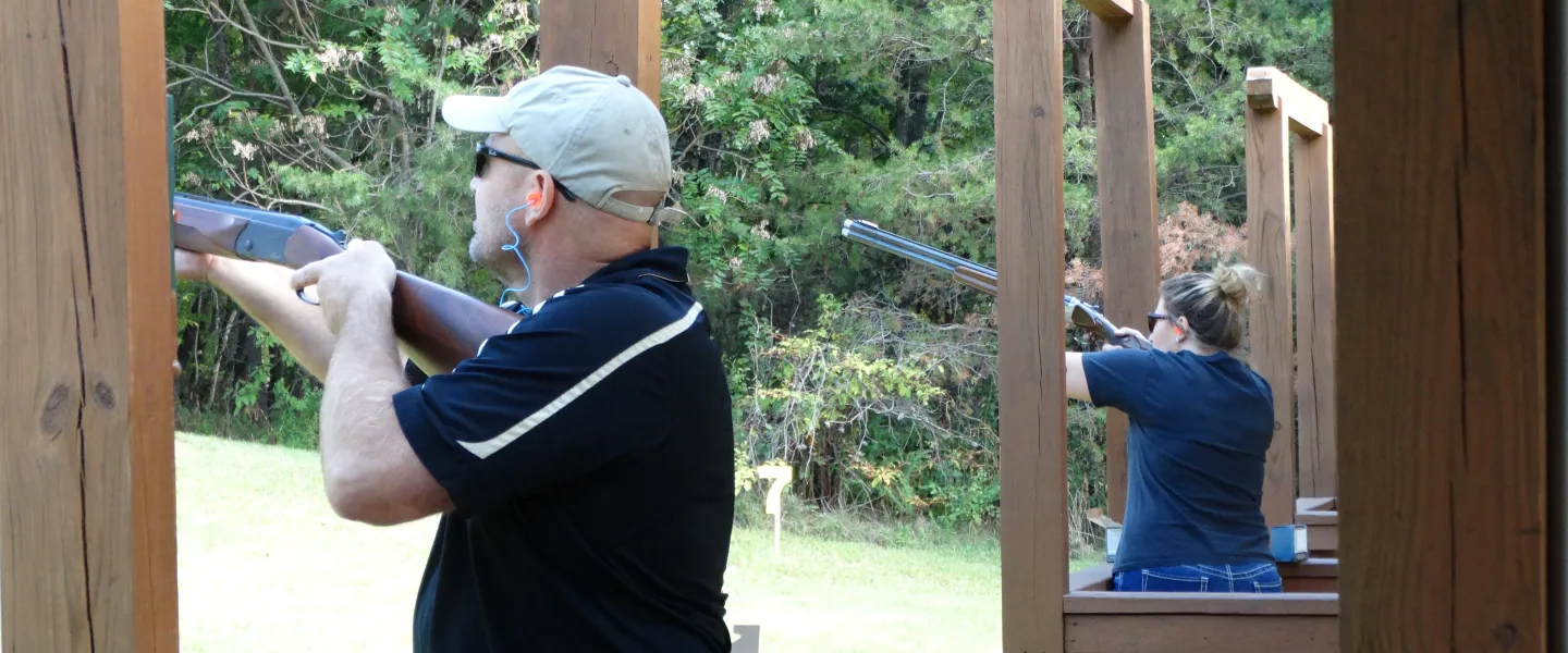 Adults shooting clays