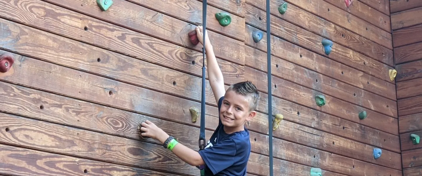 Boy on climbing wall
