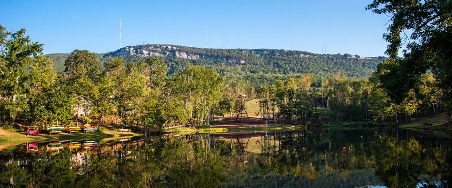 Looking across a reflective lake at Sauratown Mountain