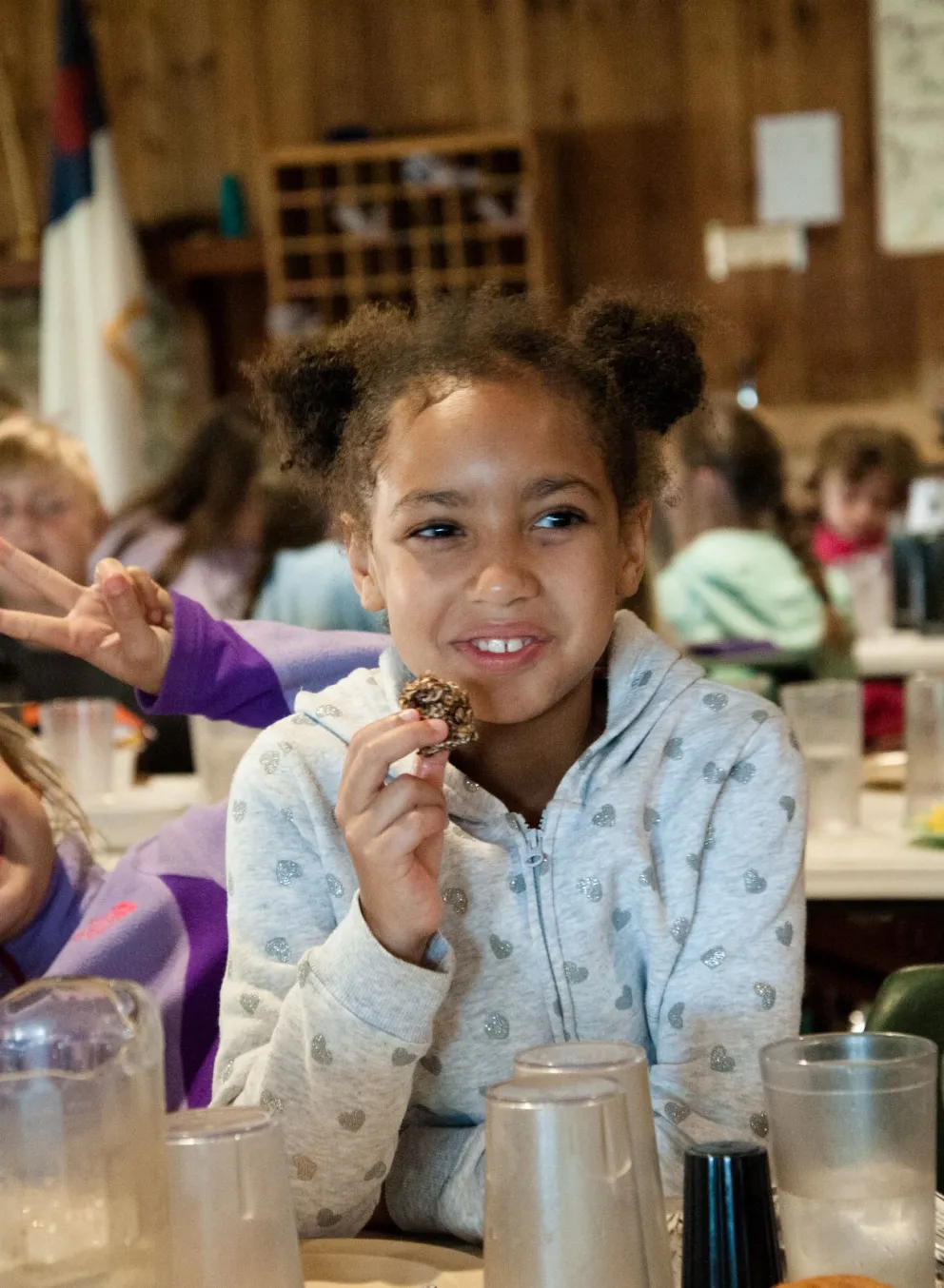 Girls eating cookies at Camp Hanes winter camp