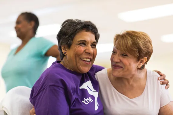 Two adult women smiling