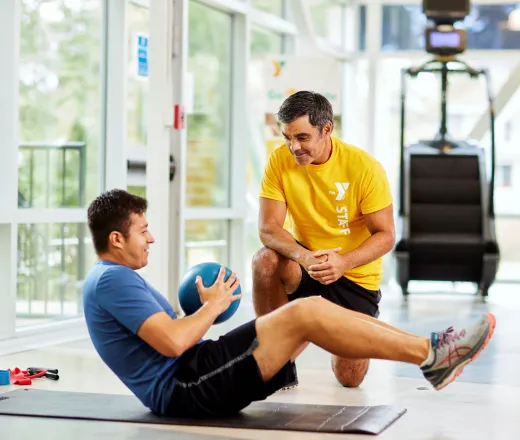 Man working out with trainer
