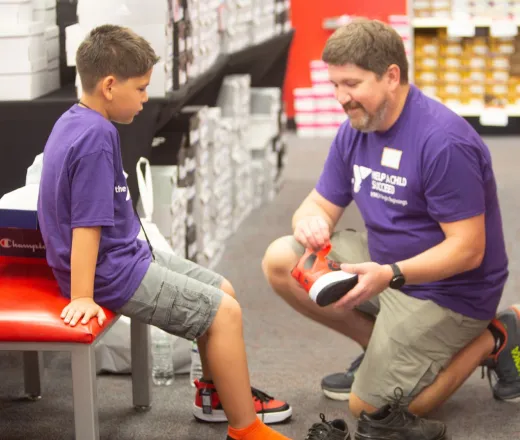 Boy trying on new shoes