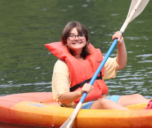 Camper within a kayak, close up shot.