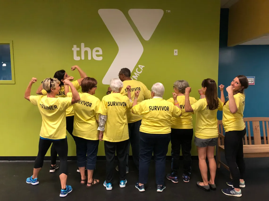 LIVESTRONG participants from behind showing their survivor shirts