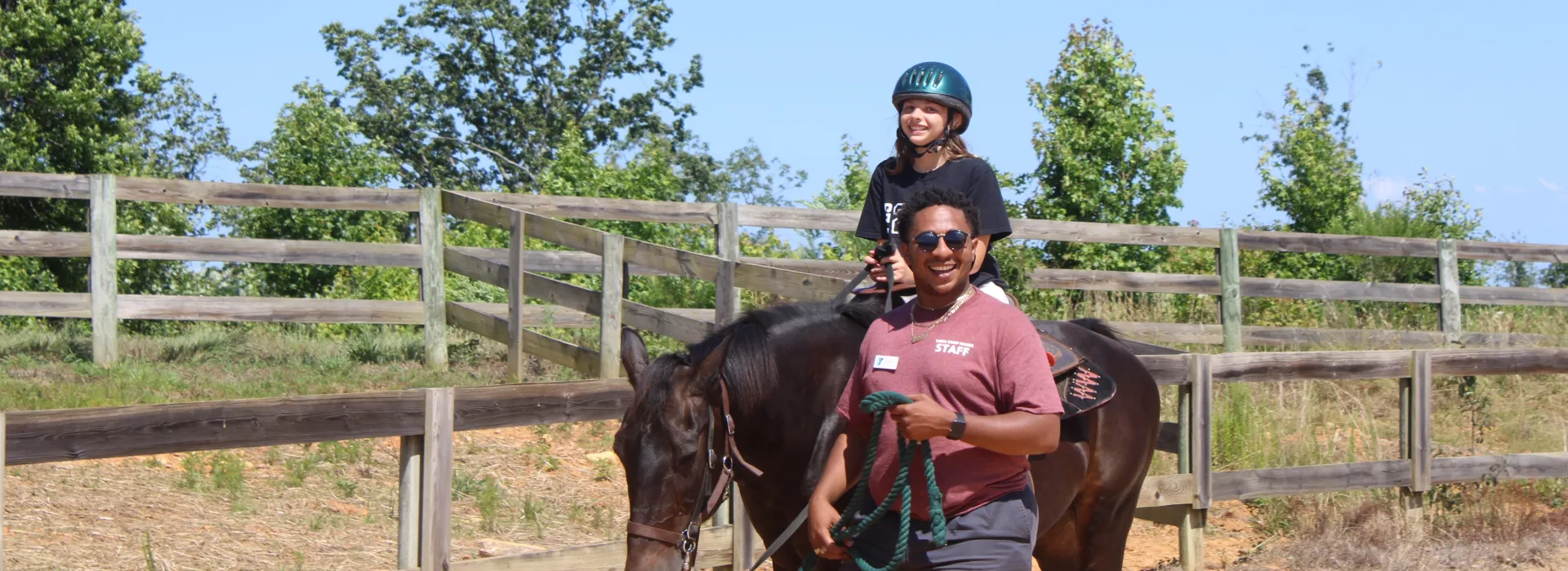 Child on horse with a staff leader